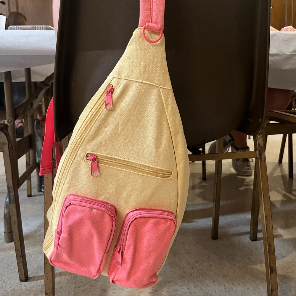 Yellow and pink cross back backpack